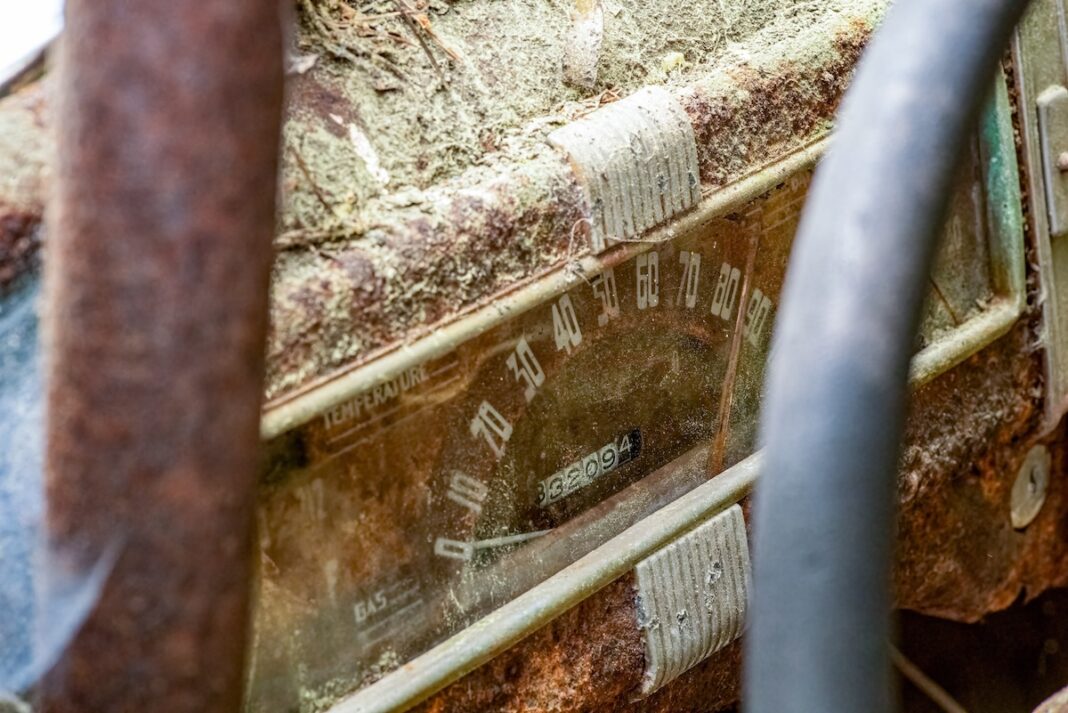 Close-up,Of,A,Rusted,And,Moss-covered,Vintage,Car,Dashboard,With